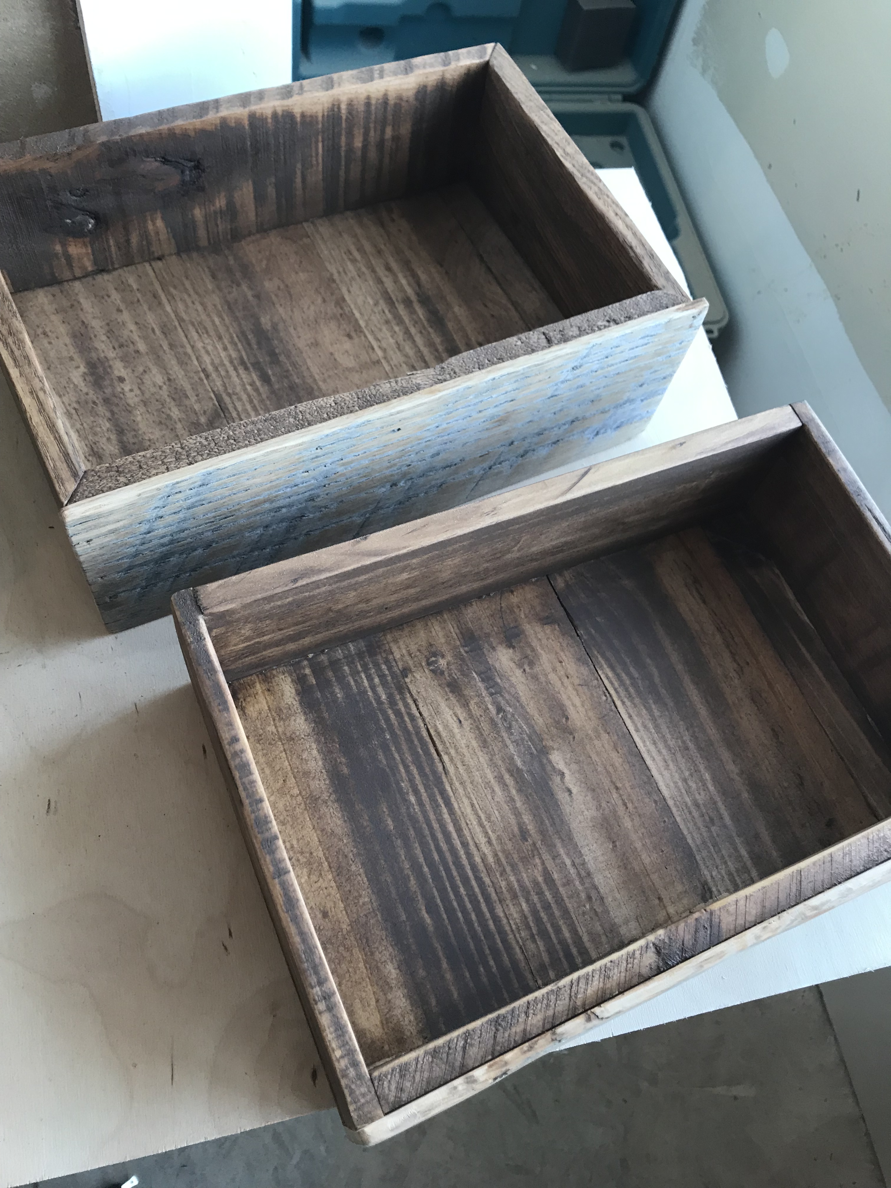 Two dark stained drawer boxes 
