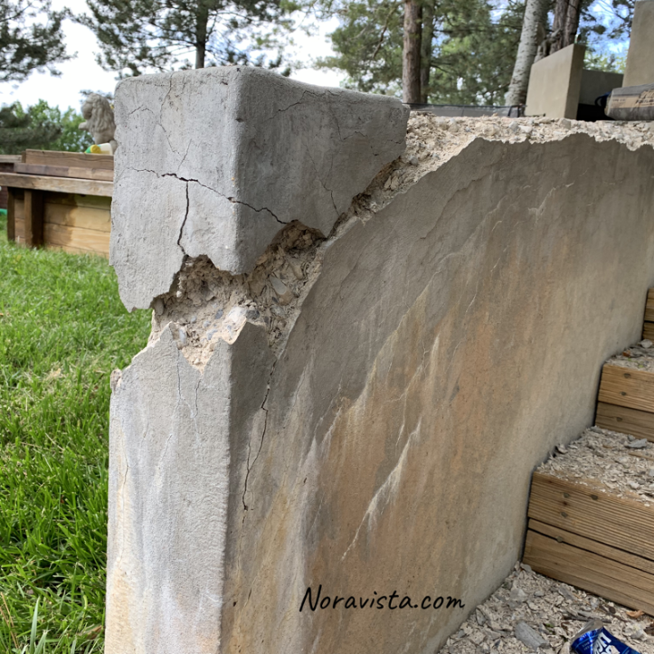 A crumbling cement wall corner in need of repair